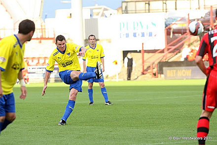 Martin Hardie fires free kick at goal
