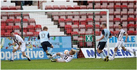 Neil McGregor slides in to prevent a goal Neil McGregor slides in to prevent a goal