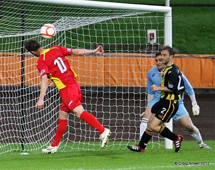 Andy Kirk manages to head over Andy Kirk manages to head over
