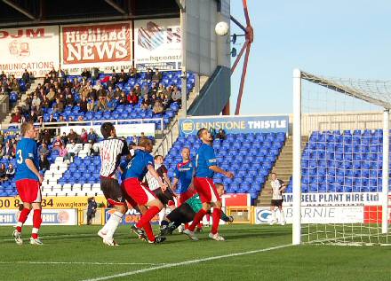 Andy Kirk sends the ball into the net Andy Kirk sends the ball into the net